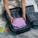 Packing a suitcase with clothes