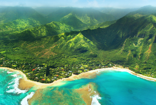 Hawaii aerial view, shoreline beach, lush green mountains