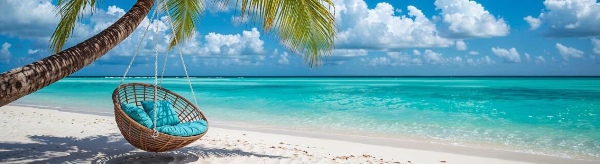 Rattan chair hanging on palm tree on beach.