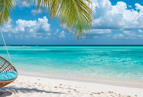 Rattan chair hanging on palm tree on beach.
