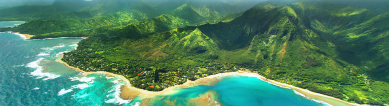 Hawaii aerial view, shoreline beach, lush green mountains