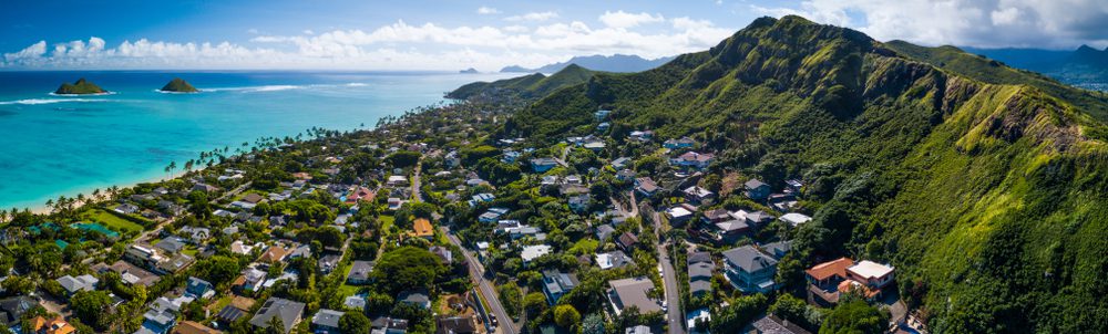 East coast of Oahu, Hawaii - green ridges of mountains, neighborhood houses, ocean view