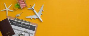 Hawaii Travel Tips for First Timers: Things to Know Before You Go Travel insurance form on clipboard, stethoscope, passport, decorations and copy space on yellow background