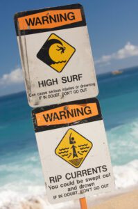 Surf and Currents Warning Sign on a beach in Hawaii.
