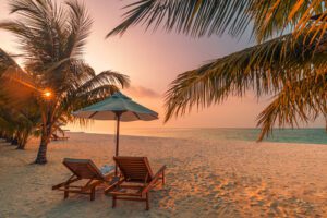 beautiful,tropical,sunset,scenery,,two,sun,beds,,loungers,,umbrella,under