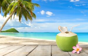 How Many Days Do You Need in Hawaii? coconut,juice,on,wooden,table,with,beach,and,blue,sky